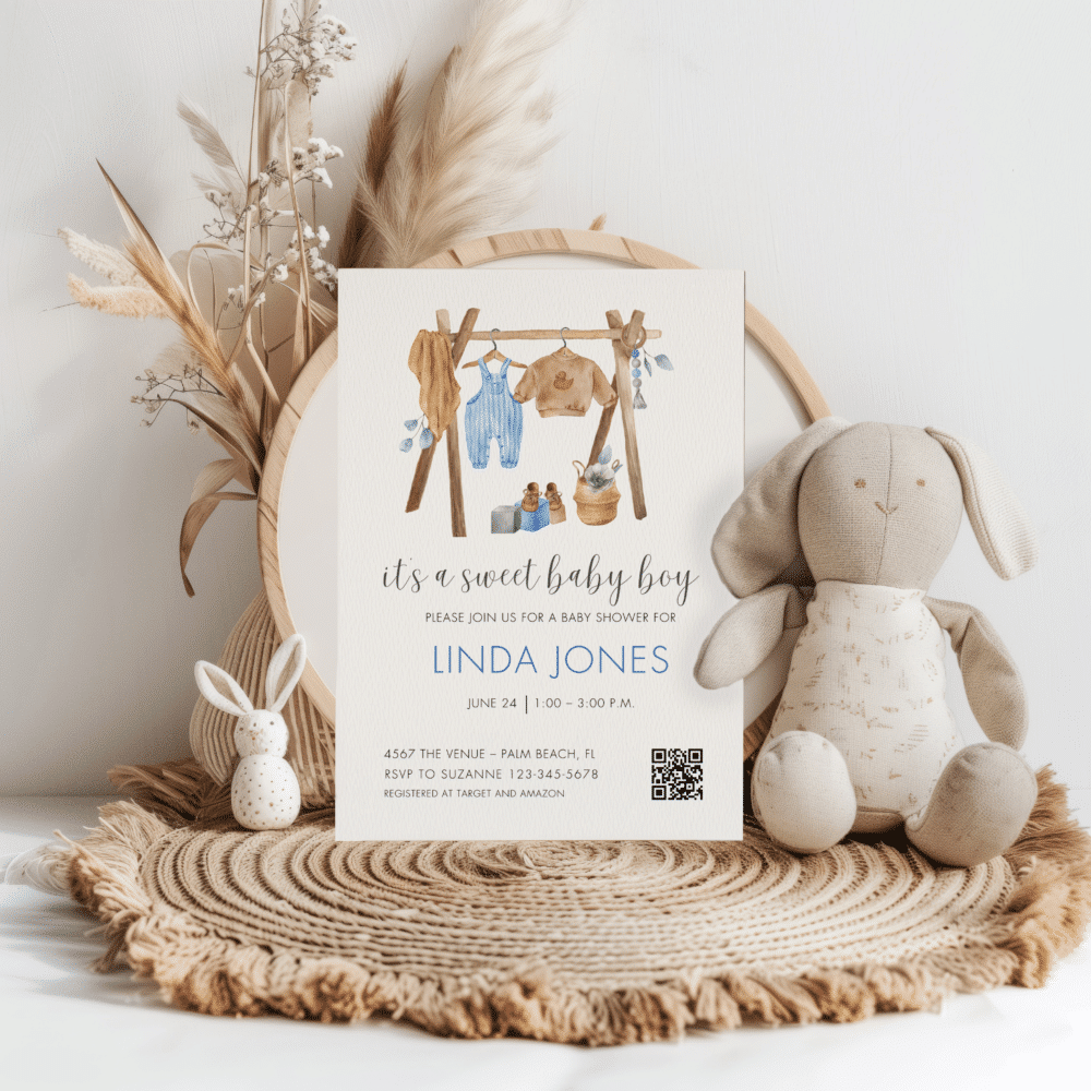 Baby clothes and shoes in blues and brown for a baby boy baby shower invitation on white paper | Patti and Hank